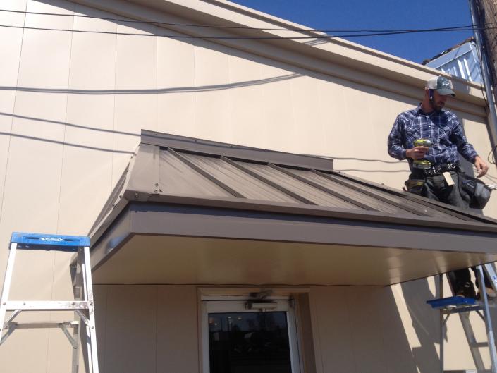 Metal awning. Wall resurfacing. Downtown Paragould. Color options available 