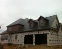 Installing metal roofs on a new home. 